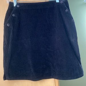 J JILL black corduroy skirt with 6 front buttons. Size 6 100% cotton.